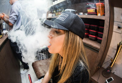 Blonde girl vaping nic salts