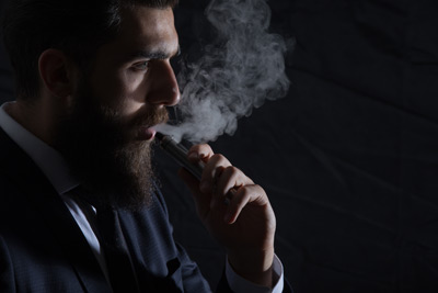 Businessman-smokes-cigarette