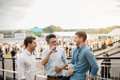 Group of Friends Vaping at an Outdoor Concert