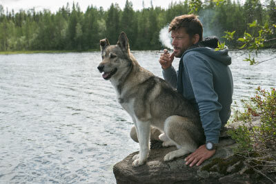 Man Vaping With Dog by the Lake