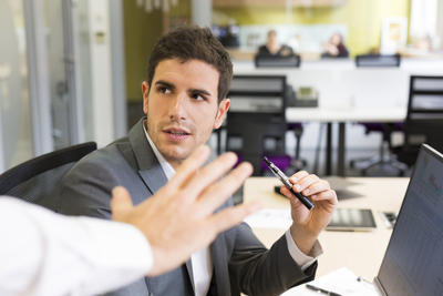 man being stopped from vaping