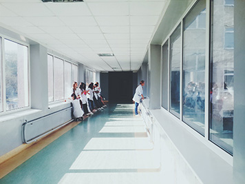 Staff congregate in hospital corridor