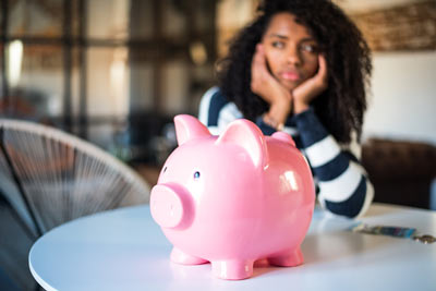 frustrated-woman-with-piggy-bank