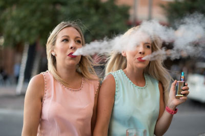 Vapers using e-cigarettes on holiday