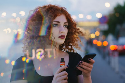 Woman Vaping in the City